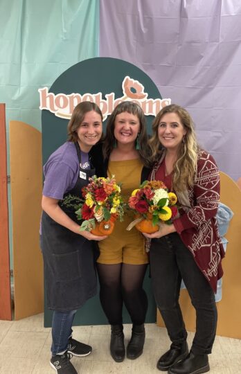 Kaija Johnson, Kelly Krenzel, and Katie Gehring with bouquets